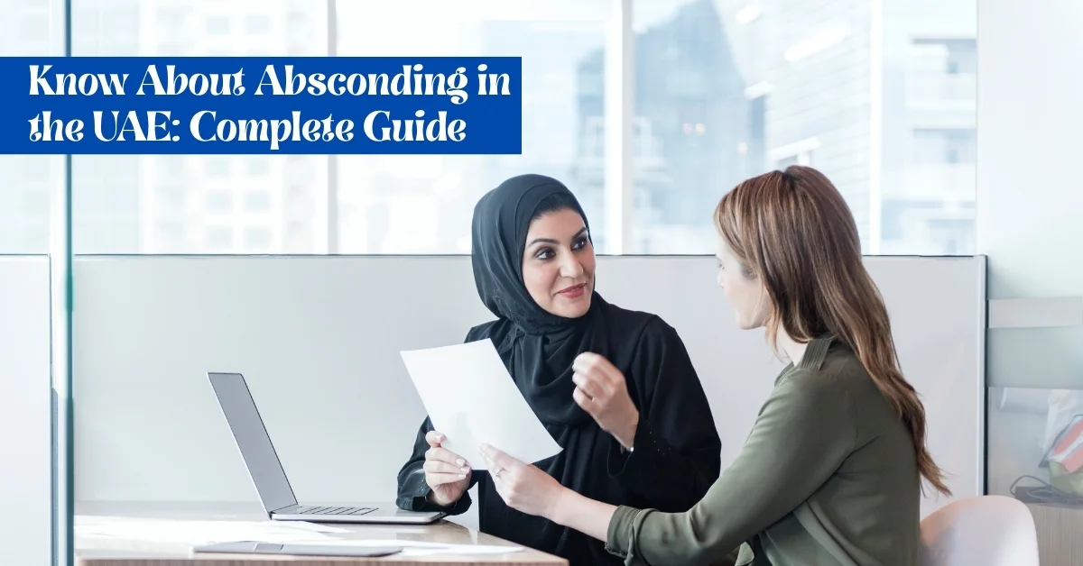Image of two businesswomen in a UAE office discussing absconding laws and employment issues.