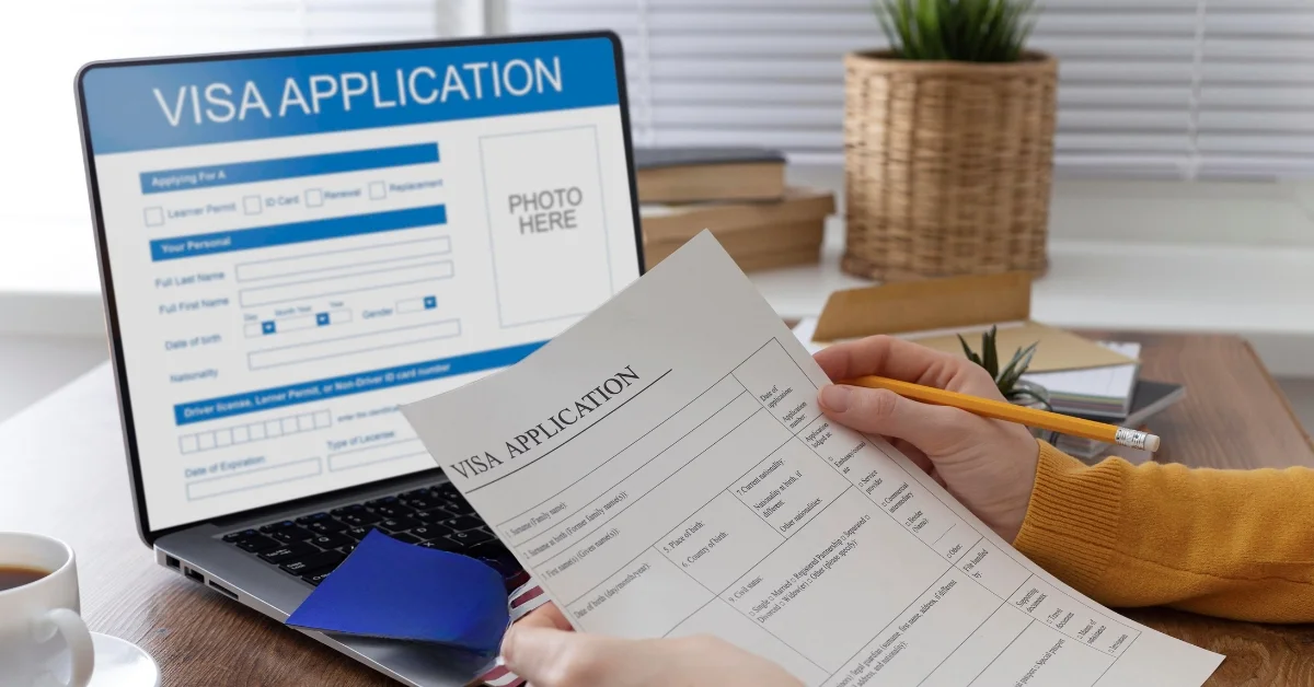 Image of Dubai Visit Visa extension online process with passport, UAE flag, and laptop screen.