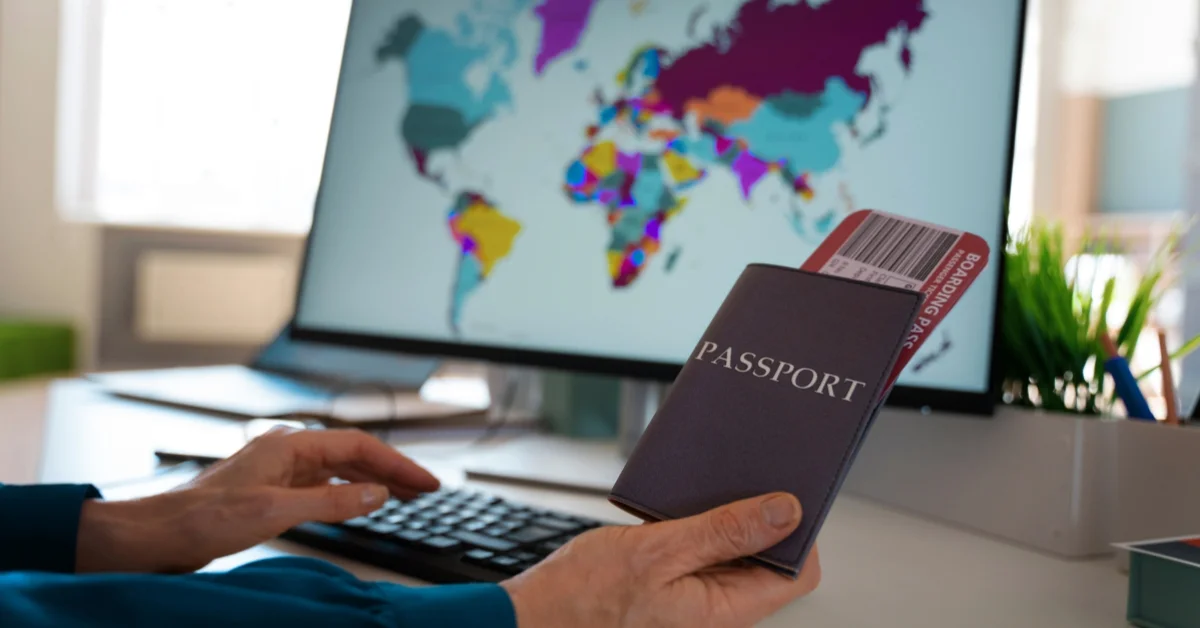 Image of Person checking UAE visa status by passport number online on laptop and phone with Dubai skyline background