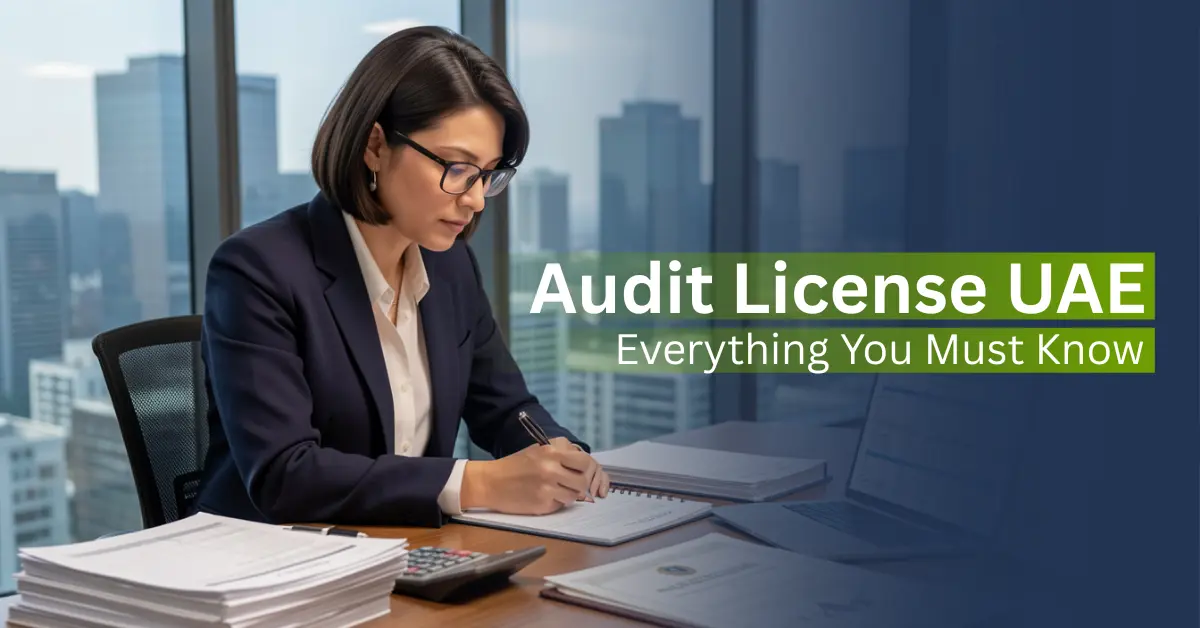 Licensed auditor reviewing financial documents in a UAE office explaining audit license requirements for businesses