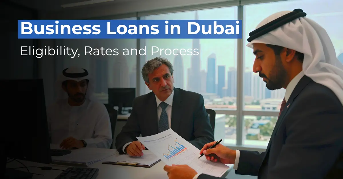 Three professionals, including a man in traditional Emirati attire, reviewing financial charts in a modern office with the Dubai skyline in the background. Text overlay: Business Loans in Dubai - Eligibility, Rates and Process.