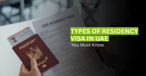 Professional reviewing UAE residency visa documents with passport and Emirates ID.