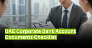 Corporate banker reviewing UAE business account document checklist with company owner in modern office