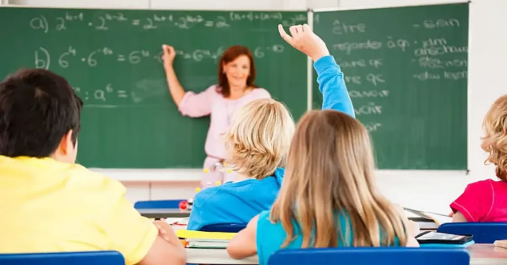 Teacher presenting UAE teaching license in modern classroom with Dubai skyline.