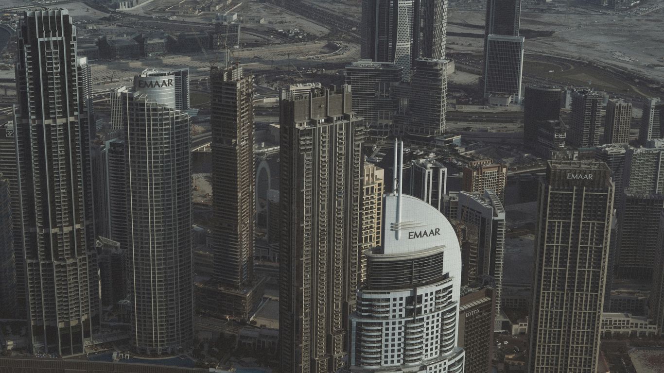 An aerial view of a city with tall buildings