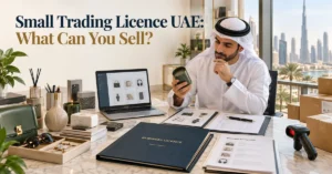 Small Trading Licence UAE showing a business owner reviewing permitted product categories, trading documents and inventory for a UAE trading company.